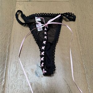 Super sexy black Victoria’s Secret panty with pink satin ties and bow in size S